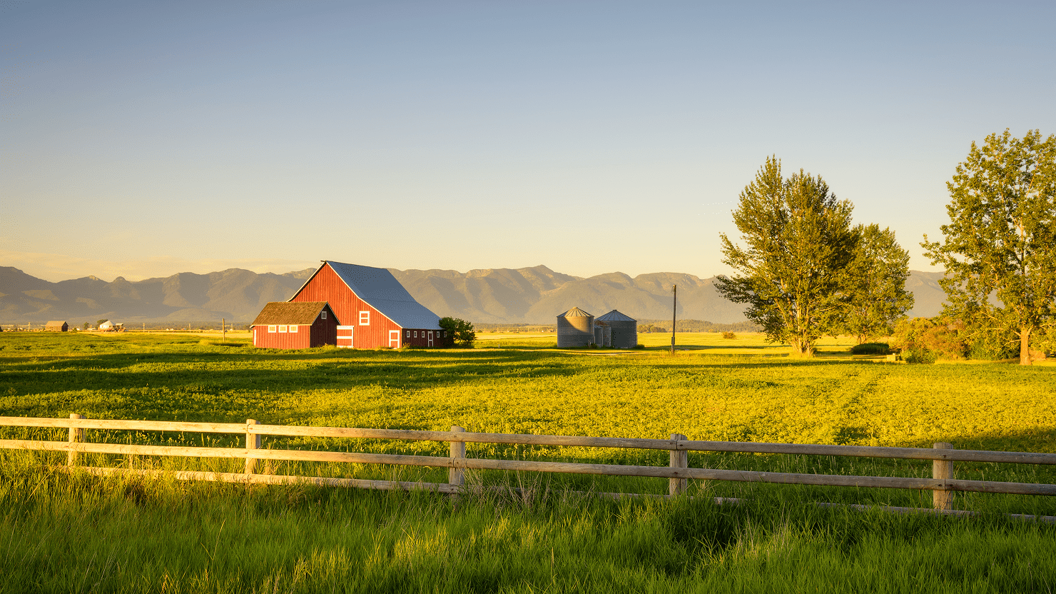 Scenic farm with mountains in background