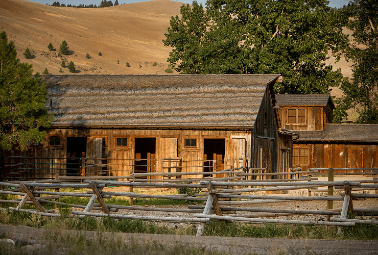 Rustic wooden barn with split-rail fence